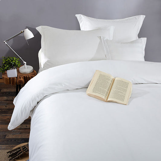 Luxury 4-piece 100% cotton bedding set displayed on bed – jet satin weave in natural light