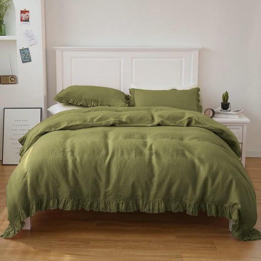 Olive green French linen duvet cover neatly folded on bed